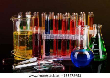 Colorful test tubes on dark background
