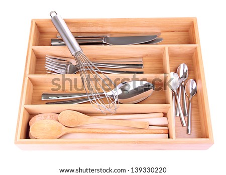 Wooden cutlery box with checked cutlery isolated on white