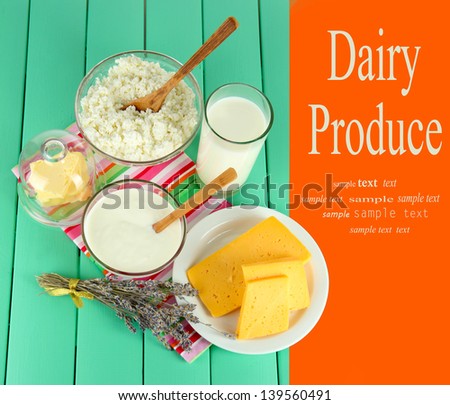 Glass of milk and cheese  on wooden table