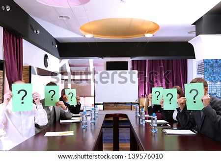 Businessmen with question marks on their faces before business training