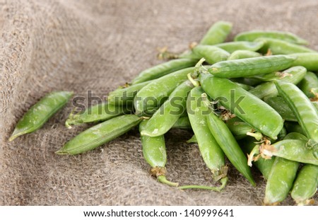Green peas on bagging background