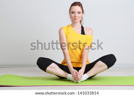 Portrait of beautiful young woman exercises