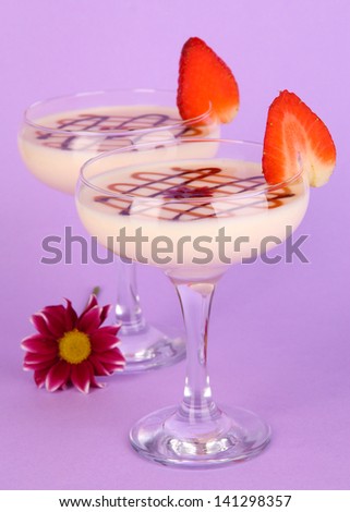 Fruit smoothies on lilac background