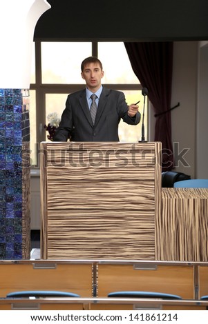 Business man is making a speech at conference room