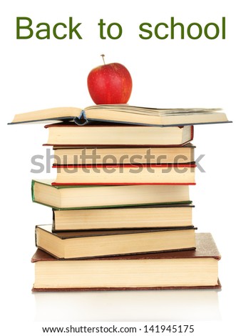 Tower of books with apple isolated on white