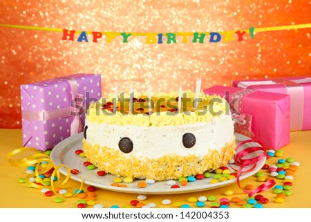 Happy birthday cake and gifts, on red background
