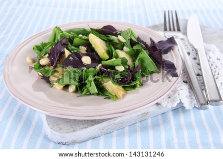 Light salad on plate on napkin