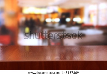 Wooden table on cafe background
