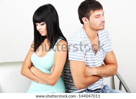 Beautiful loving couple quarrel in room