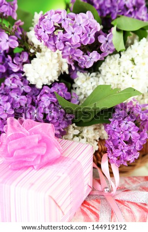 Beautiful lilac flowers with presents, close up