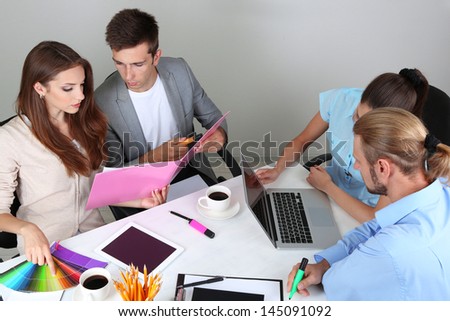 Business team working on their project together at office