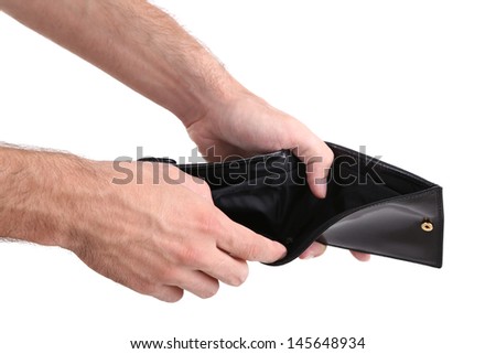 Man showing his empty purse, isolated on white