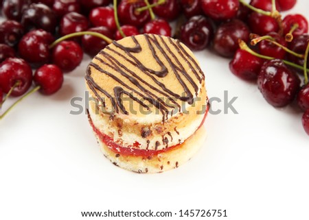 Tasty biscuit cake and berries isolated on white