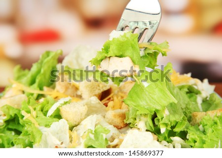 Caesar salad, close up, on bright background
