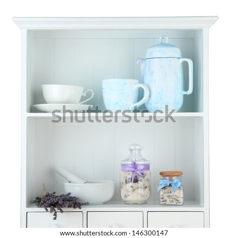 Still life with jar of lavender sugar, mortar and fresh lavender flowers on shelves