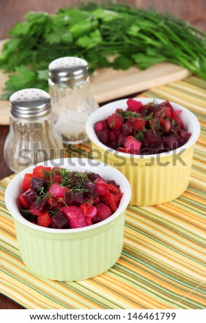Beet salad in bowls on table close-up