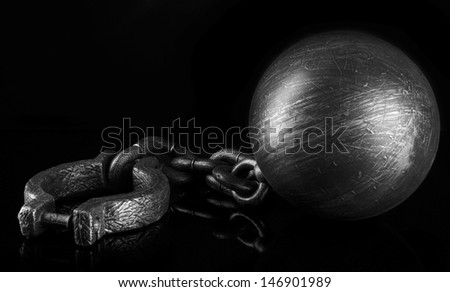 Ball and chain on black background