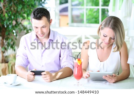 Young couple  taking  with tablet in restaurant