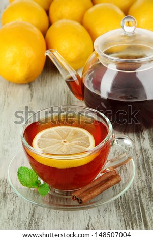 Cup of tea with lemon on table close-up