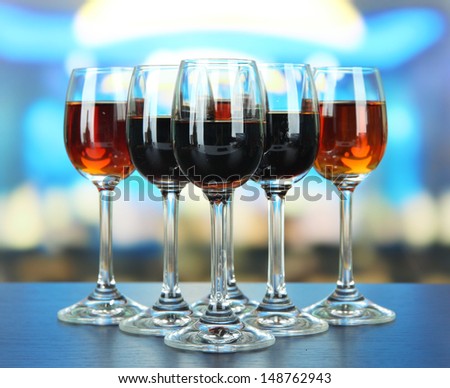 Glasses of liquors, on bright background