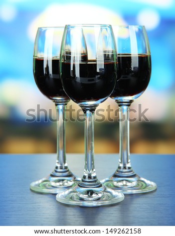 Glasses of liquor,  on bright background