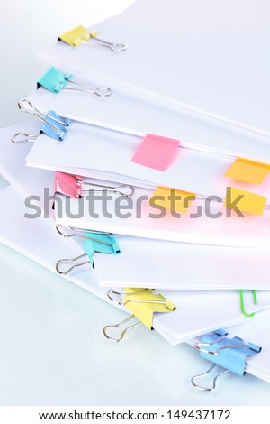 Documents with binder clips close up