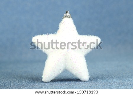 White Christmas star on blue background