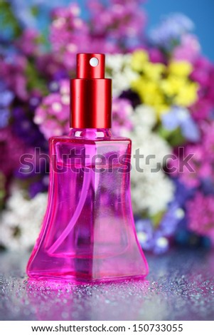 Women perfume in beautiful bottle and flowers