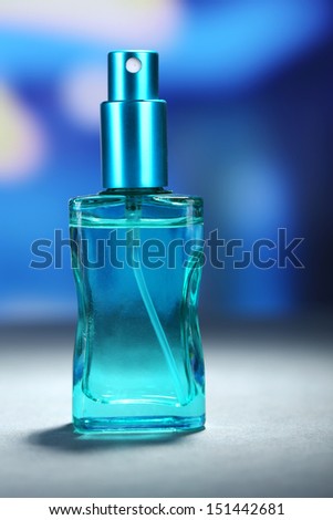 Women perfume in beautiful bottle on bright background