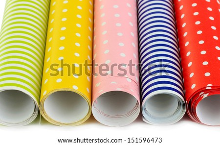 Color papers for wrapping gifts isolated on white