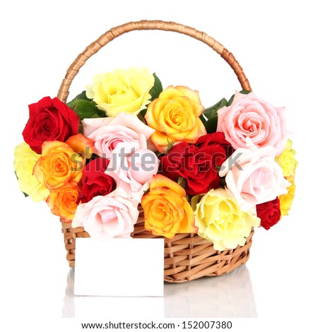 Beautiful bouquet of roses in wicker basket isolated on white