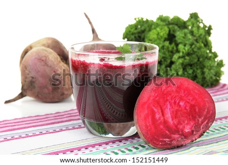 Fresh juice of beets on table on white background
