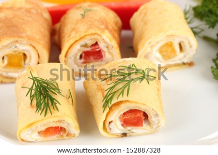 Egg rolls with cheese cream and paprika,on plate, close up