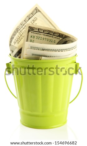 Money in  trash can, isolated on white
