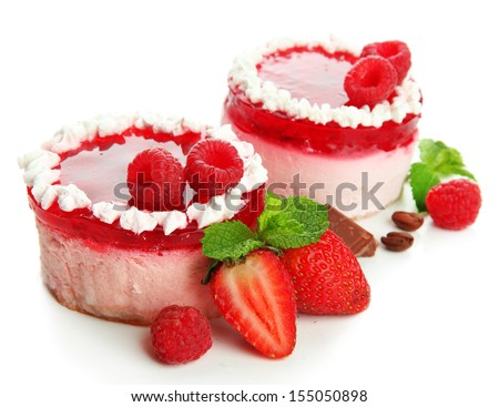 Delicious berry cakes isolated on white