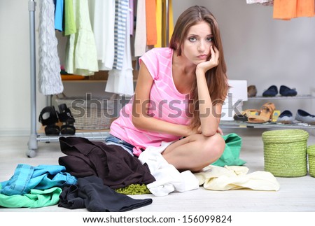 Beautiful Girl Thinking What To Dress In Walk-In Closet