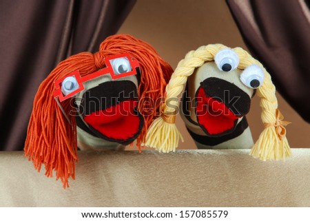Puppet show on brown background