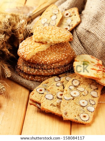 Homemade cookies with sesame seeds and Italian biscuit,  on wooden  table, on sackcloth background