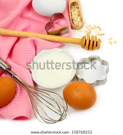 Cooking concept. Basic baking ingredients and kitchen tools isolated on white
