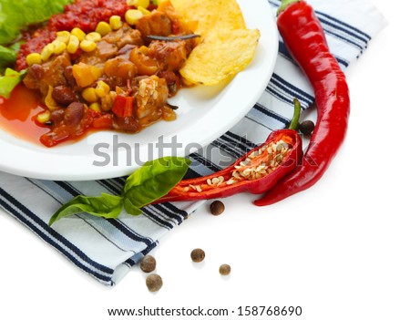 Chili Corn Carne - traditional mexican food, on white plate, on napkin, isolated on white