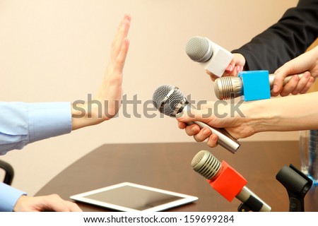 Conceptual photo of businessman or politician giving no comments