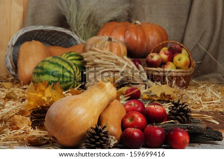Fruits and vegetables with baskets on straw close up