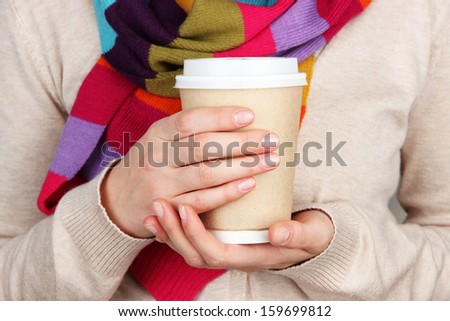 Hot Drink In Paper Cup In Hands Close Up