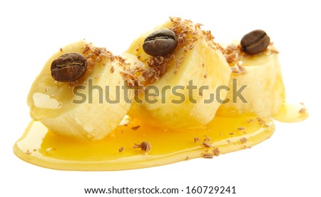 Banana slices with honey, isolated on white