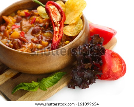 Chili Corn Carne - traditional mexican food, in wooden bowl, on  wooden board, isolated on white