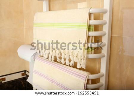 Color towels on  radiator in bathroom