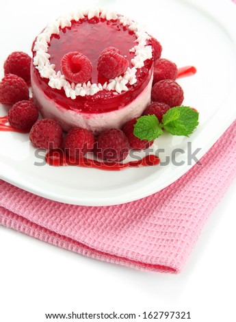 Delicious berry cake on plate close-up