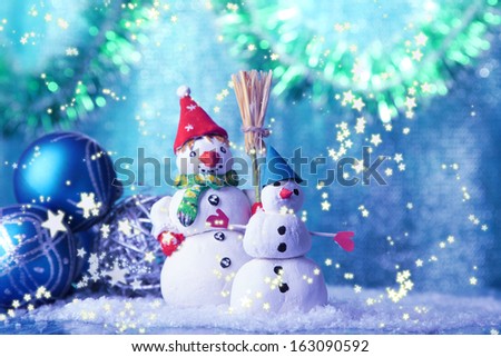 Beautiful snowmen and Christmas decor, on bright background