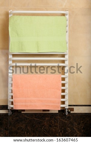 Color towels on radiator in bathroom