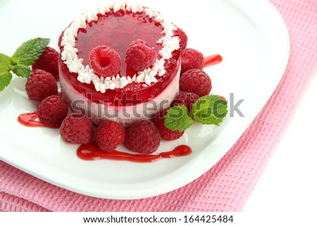 Delicious berry cake on plate close-up